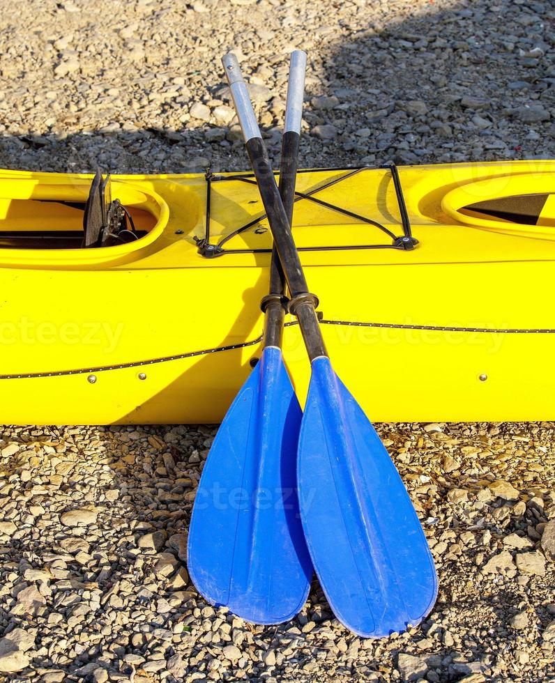 blue yellow double paddles a kayak photo