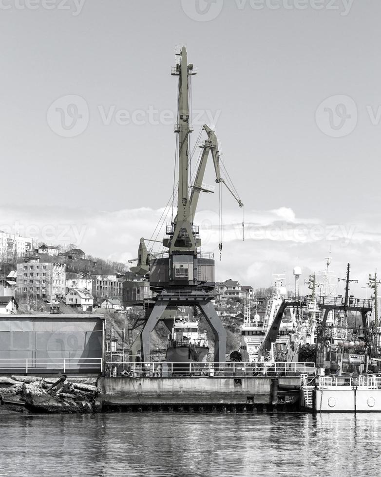 Crane in seaport in Avacha bay on Kamchatka Peninsula photo