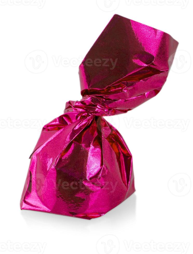 One Single colorful candy close up isolated on white background. photo