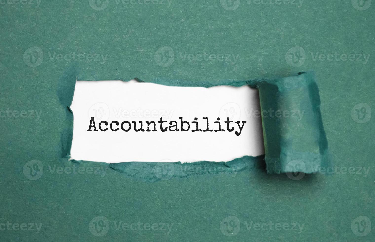 Top view of white torn paper and the text Accountability photo