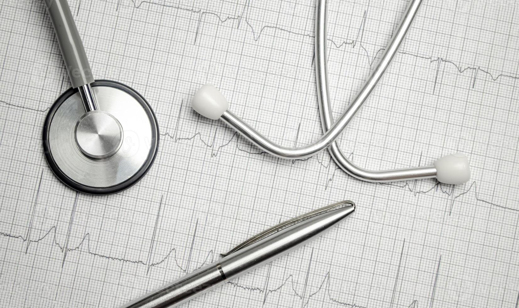 Cardiogram pulse trace and stethoscope concept for cardiovascular medical exam photo