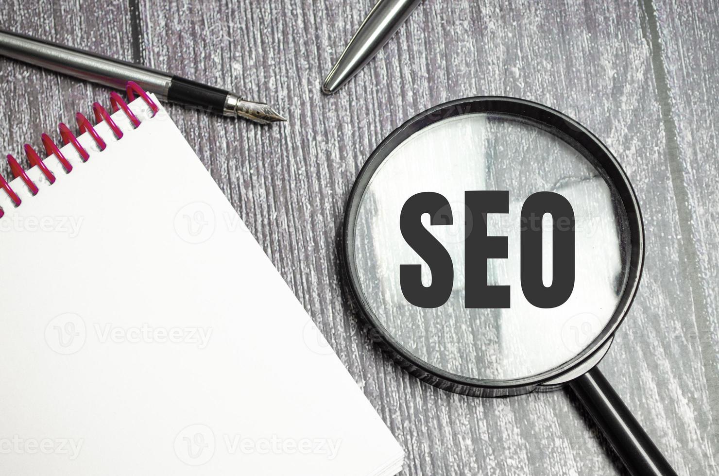 SEO word acronym through magnifier. Business concept photo