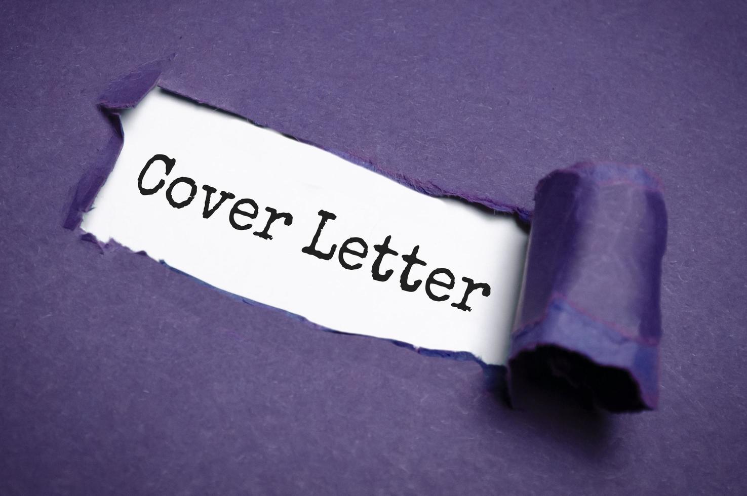 Cover letter text concept on torn paper photo