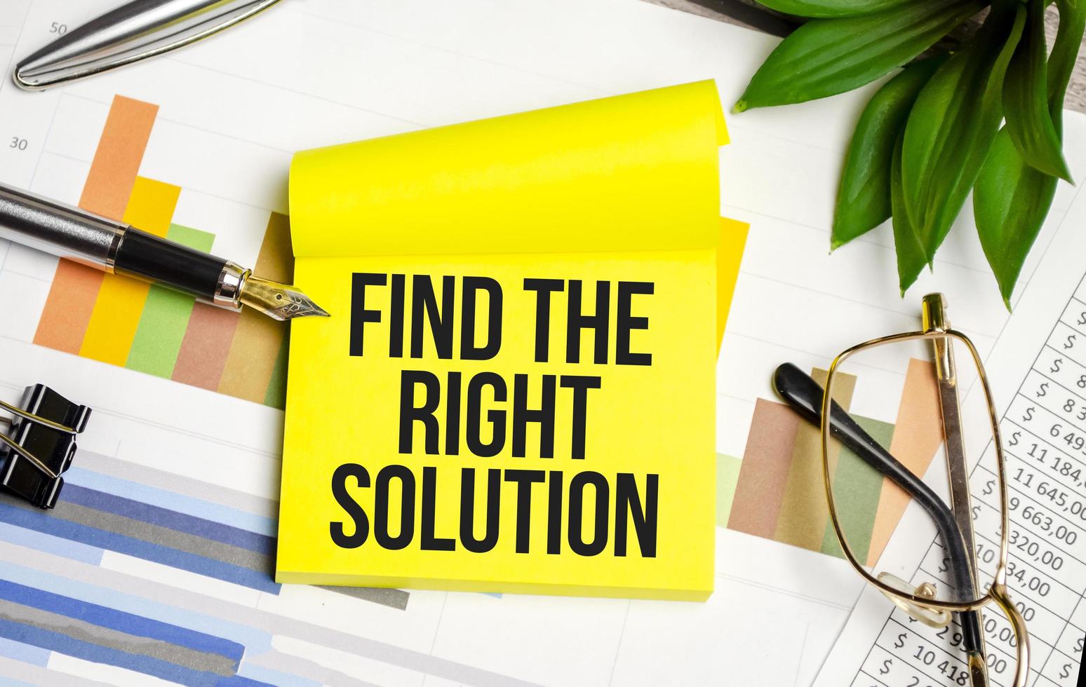 yellow sticker with the text Find The Right Solution and charts photo