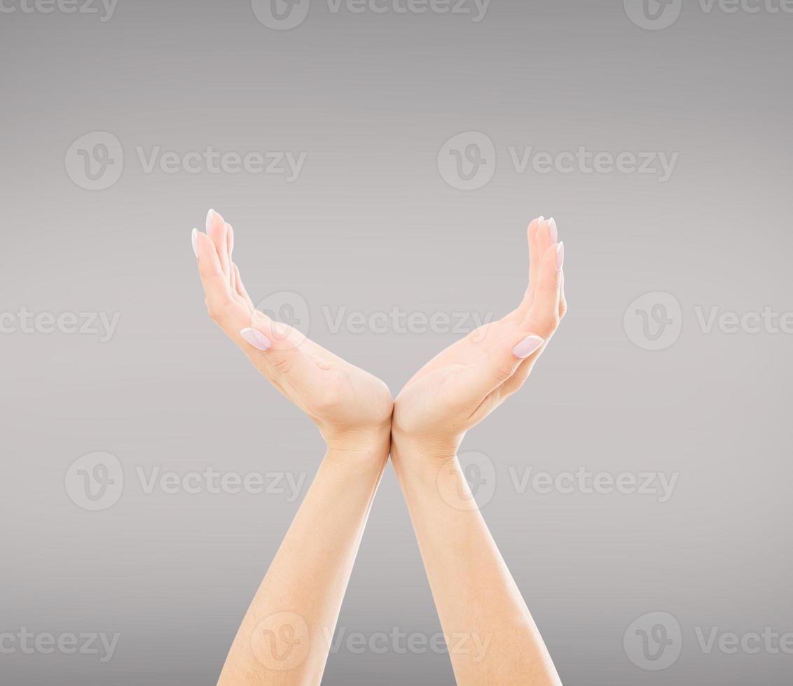 Hands holding something invisible, isolated on grey background photo