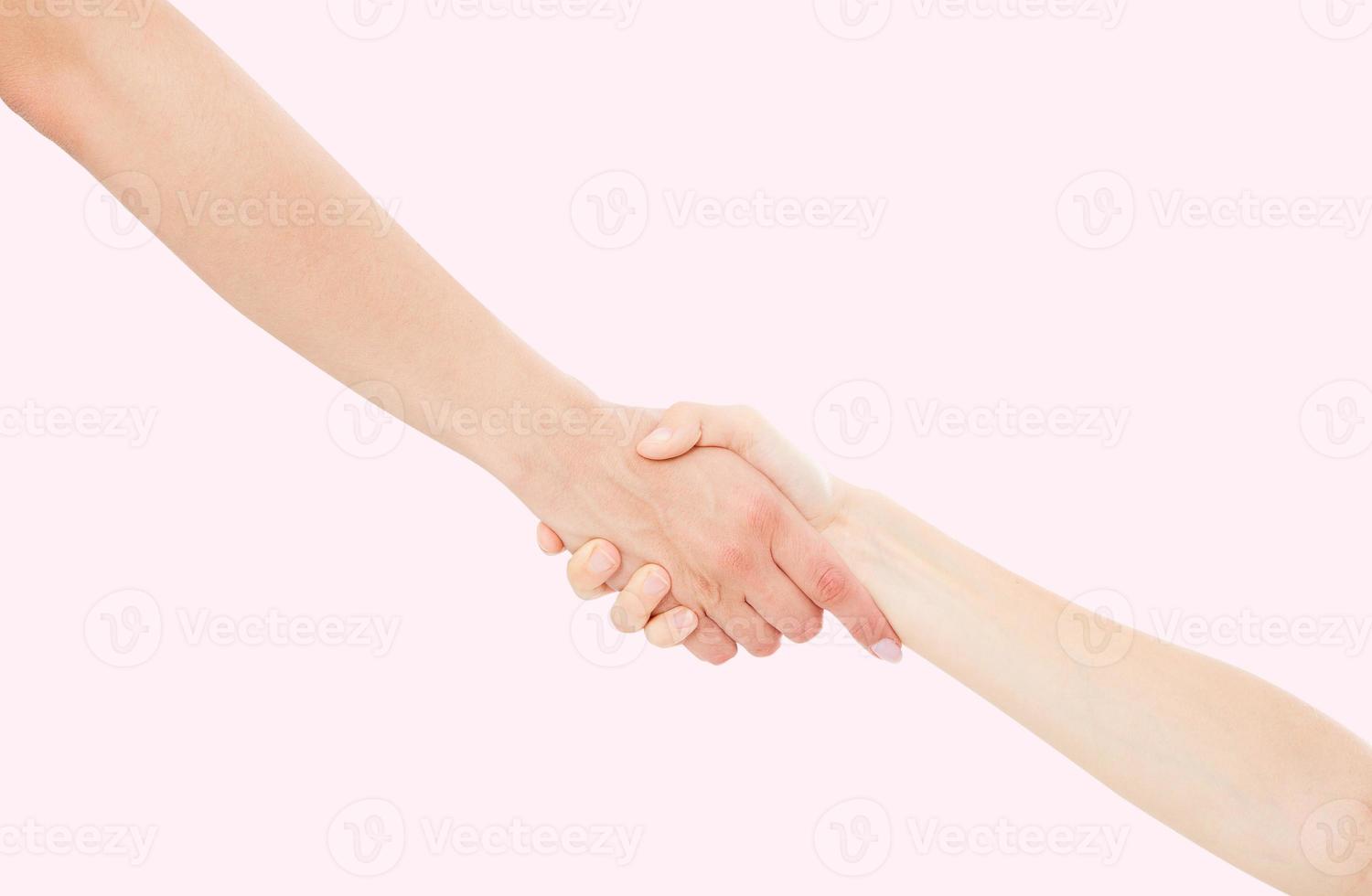 Giving a helping hand isolated on pink background, female hand photo