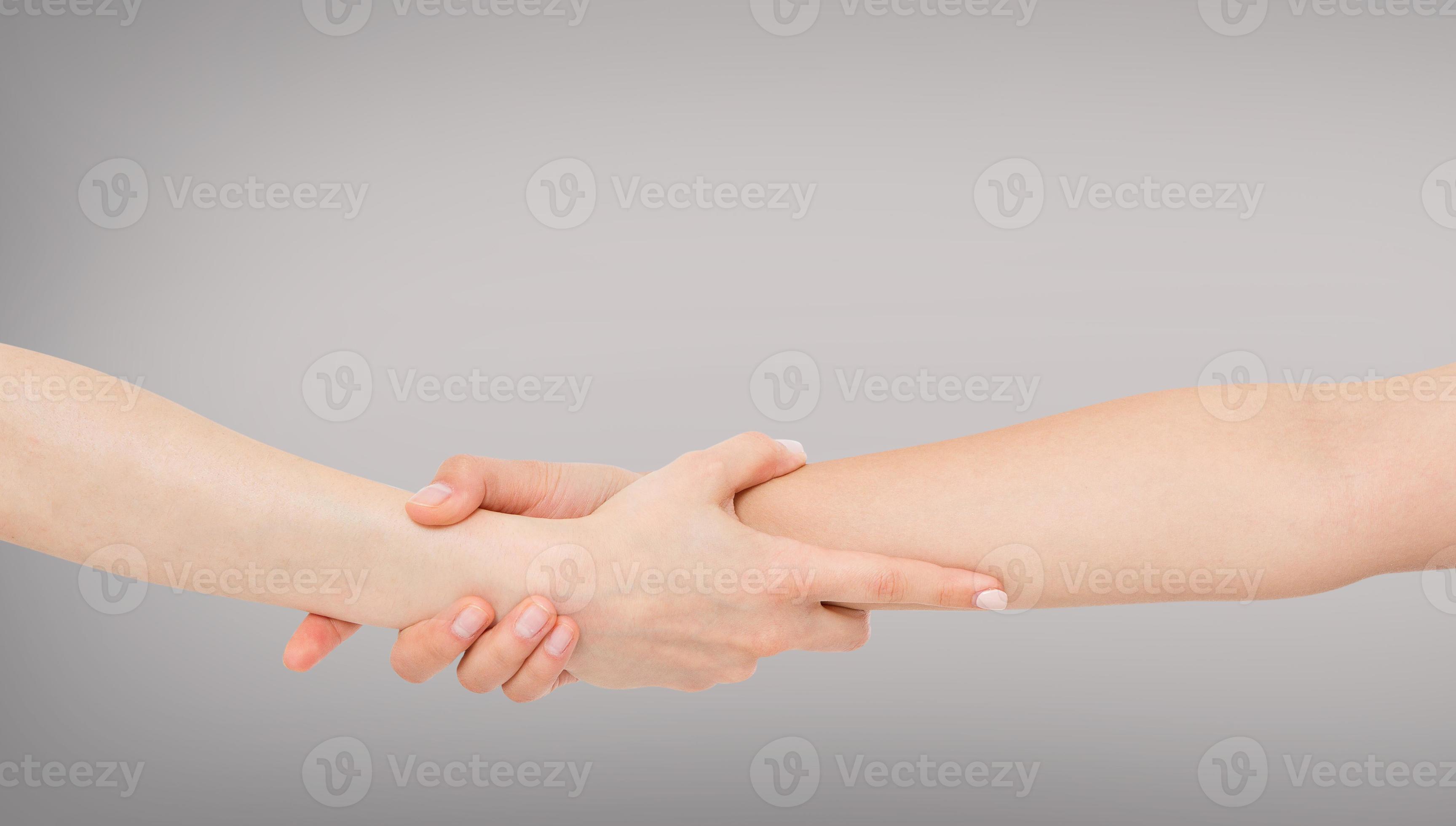 Rescuing and helping by holding or gripping the forearm.Hand and arm