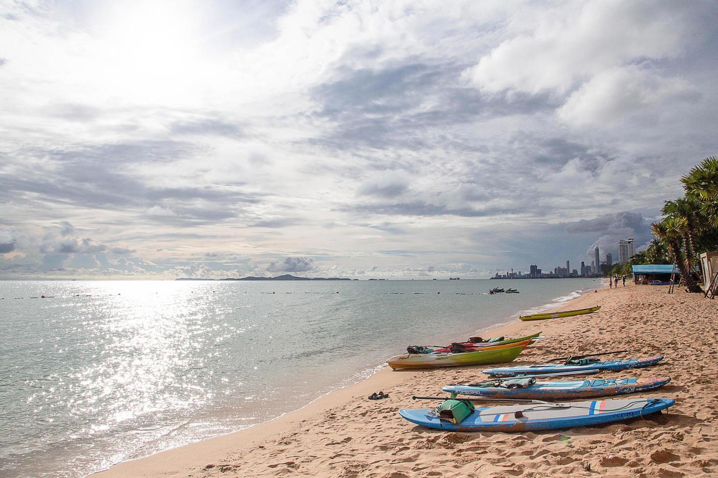 Surfboards laid by the sea, Pattaya Beach, serves tourists Pattaya, Thailand photo