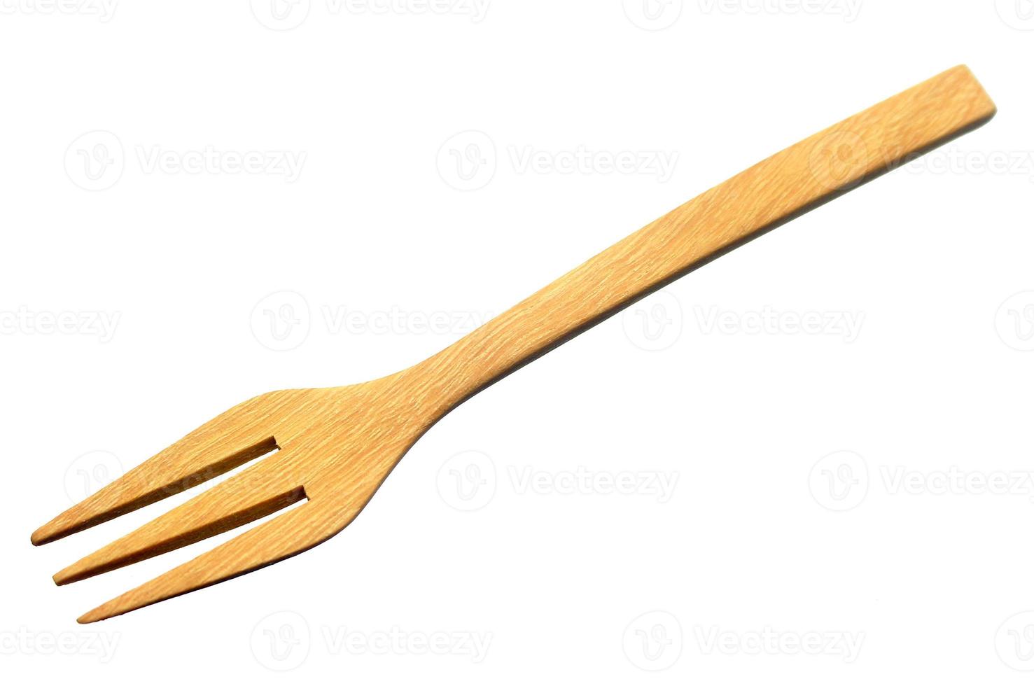 Wooden fork isolated on white background photo