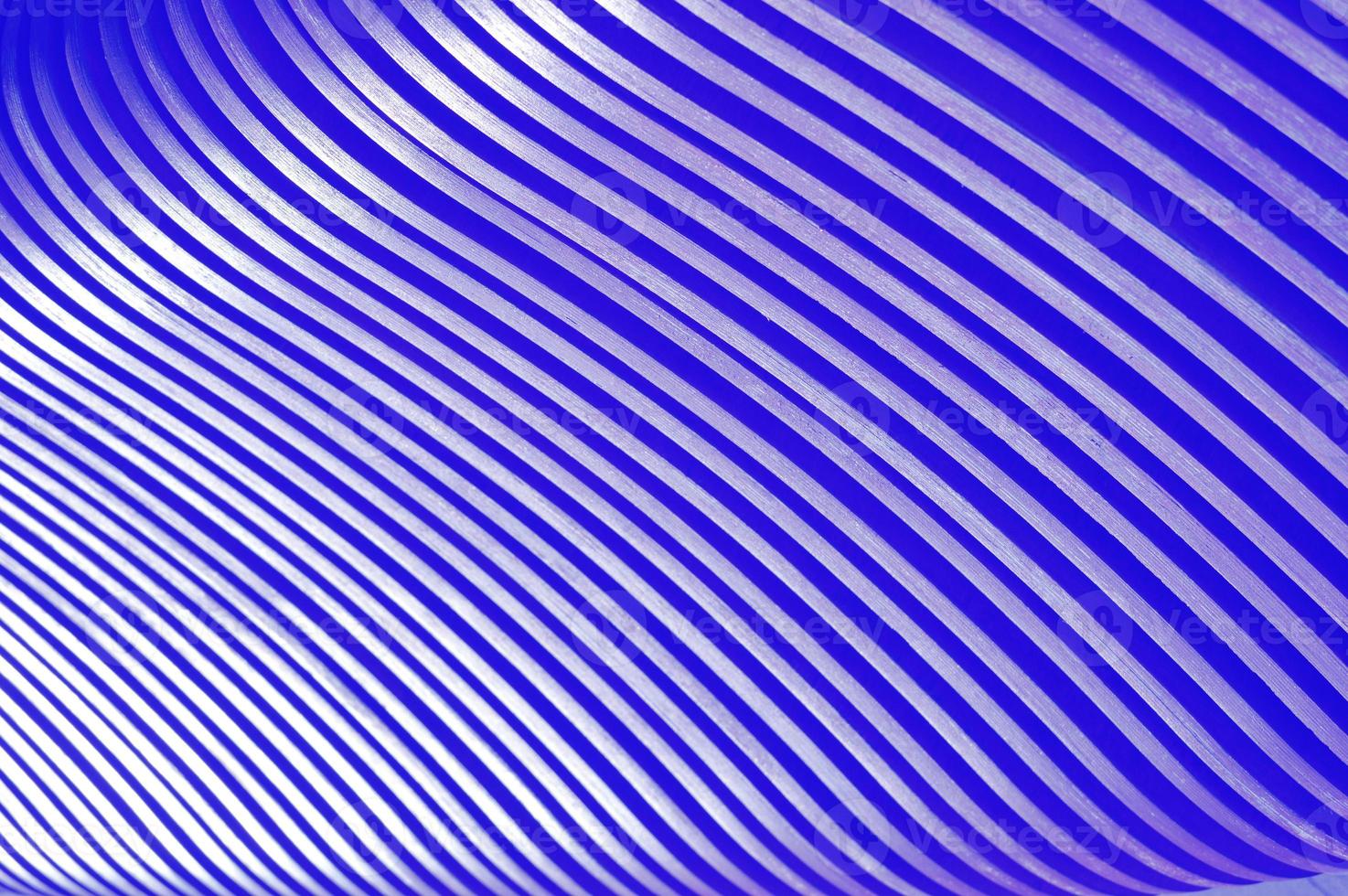Background of wooden blue curved planks, laths. A beautiful element of a wooden bench. photo