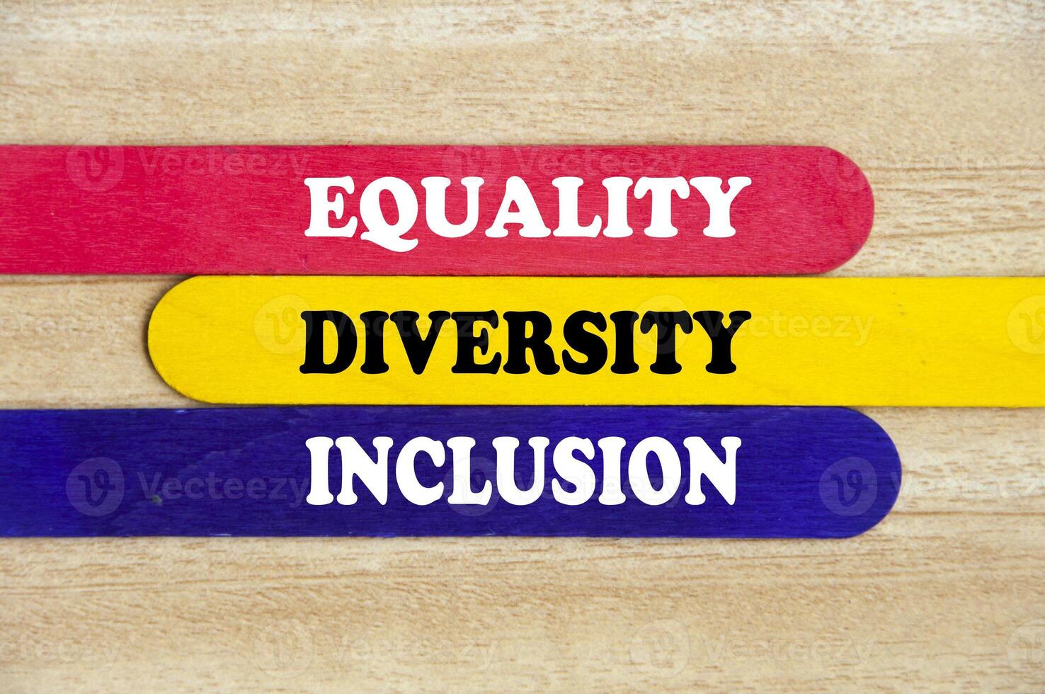 Equality, diversity and inclusion text on colorful wooden stick - Business concept photo