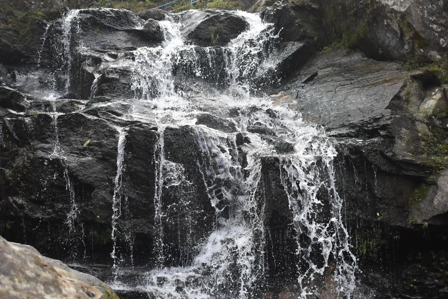 Beautiful waterfall in the mountain photo