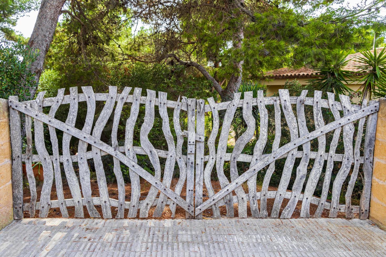 Rustic fence gate made of wood Santanyi Mallorca, Spain. photo