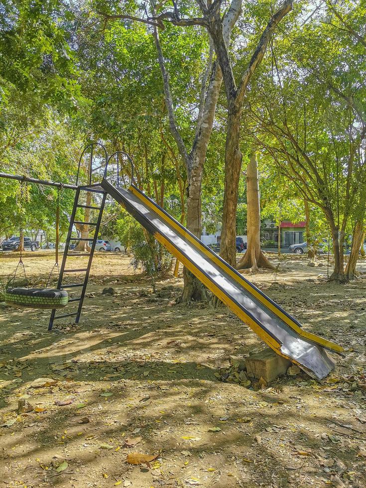 Slide and climbing frame on a playground park in Mexico. photo