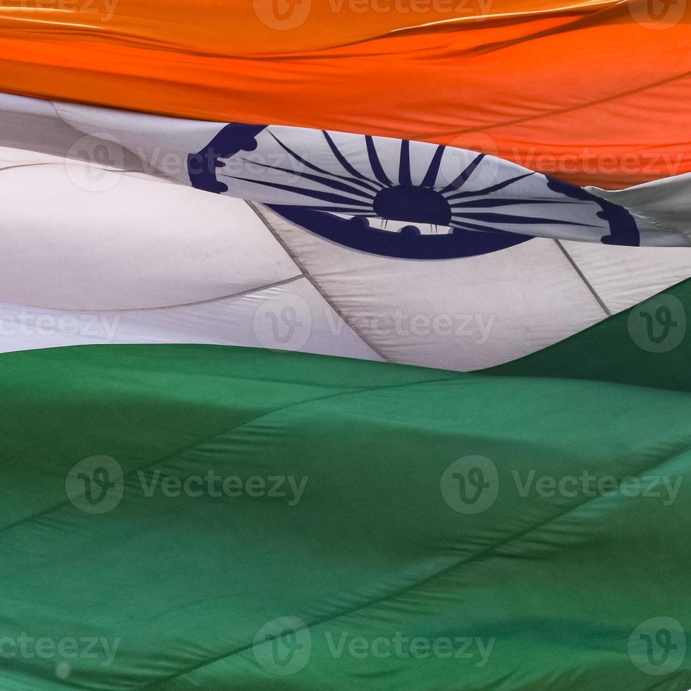 India flag flying high at Connaught Place with pride in blue sky, India flag fluttering, Indian Flag on Independence Day and Republic Day of India, tilt up shot, waving Indian flag, Flying India flags photo