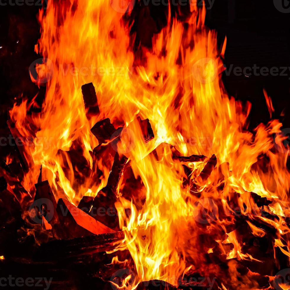Fire flames on black background, Blaze fire flame texture background, Beautifully, the fire is burning, Fire flames with wood and cow dung bonfire photo