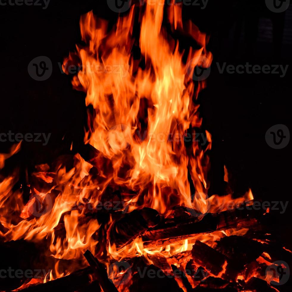 Fire flames on black background, Blaze fire flame texture background, Beautifully, the fire is burning, Fire flames with wood and cow dung bonfire photo