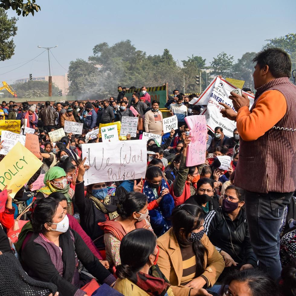 New Delhi, India December 25 2021 - Delhi Contractual Guest Teachers with posters, flags and graffiti protesting against Delhi AAP Government for making policy, Delhi Guest Teachers protesting photo