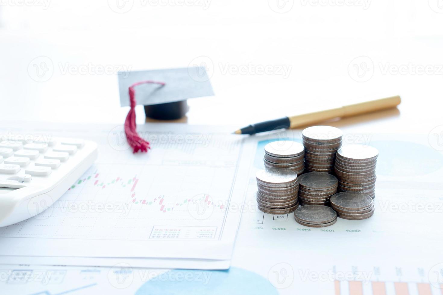 Stack Of Coins And A Black Mortarboard photo