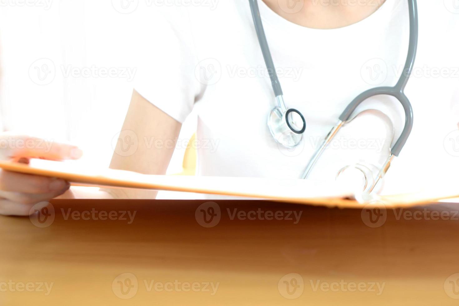 Female medical doctor reading. photo