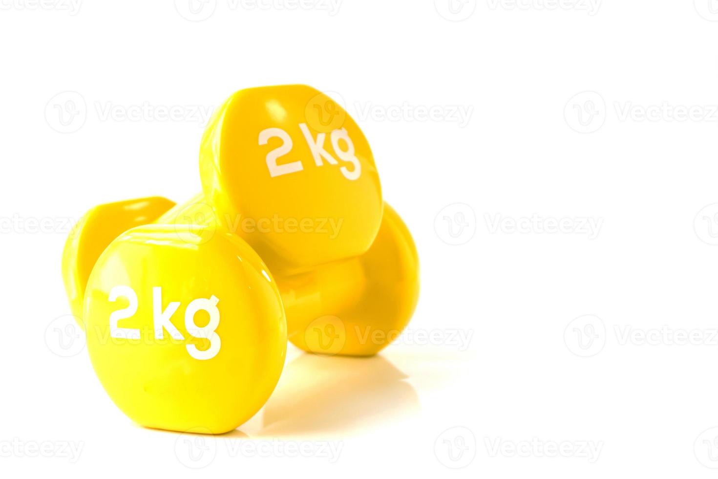 Yellow dumbbell weights photo