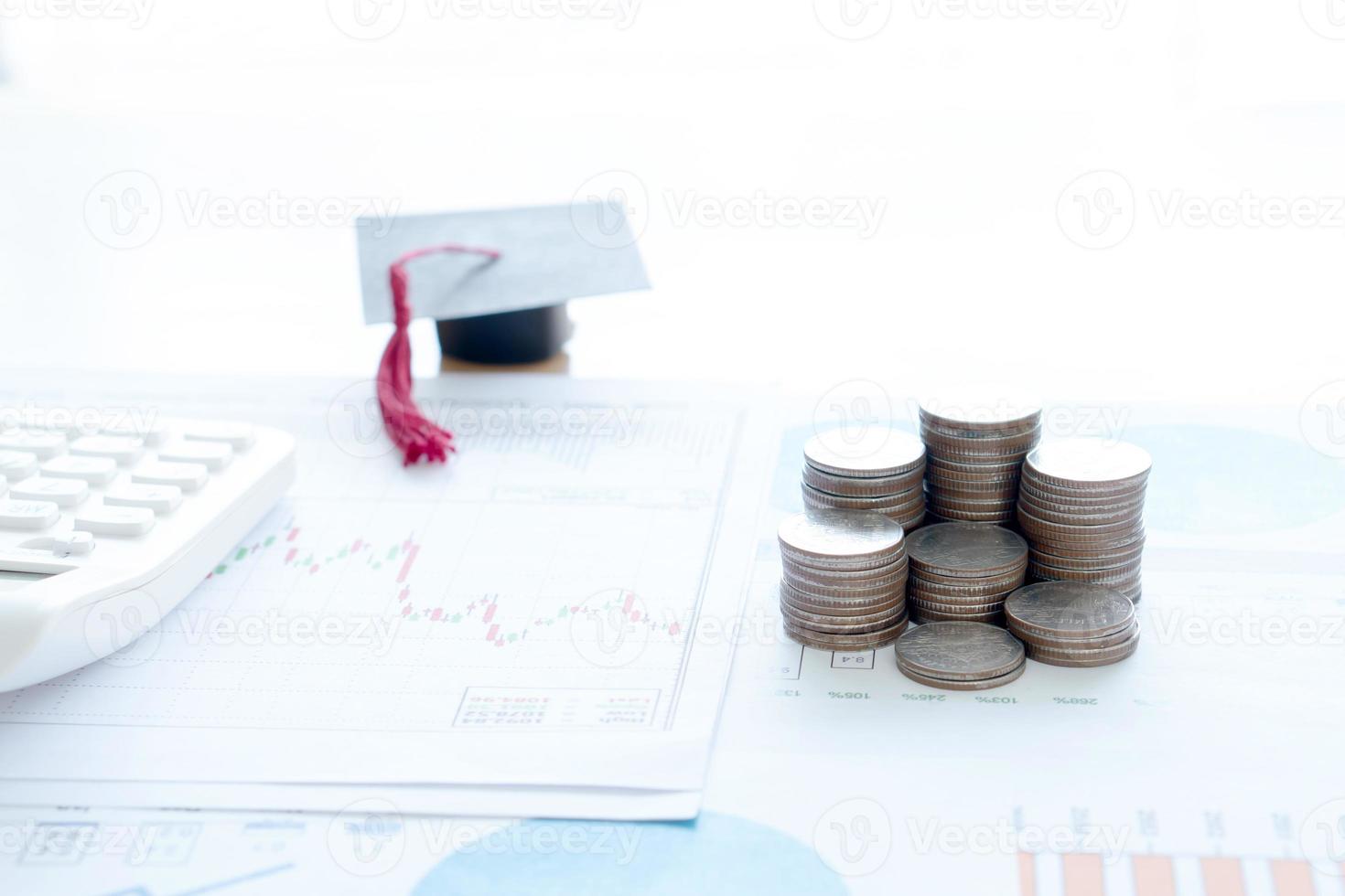 Stack Of Coins And A Black Mortarboard photo