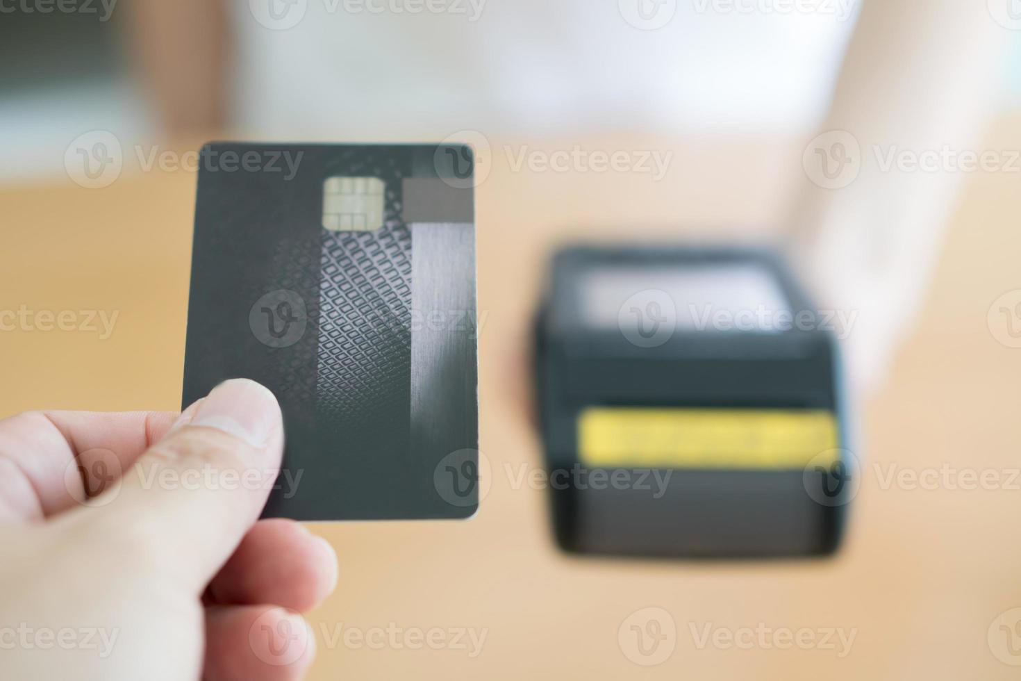 Close up of customer paying by credit card photo