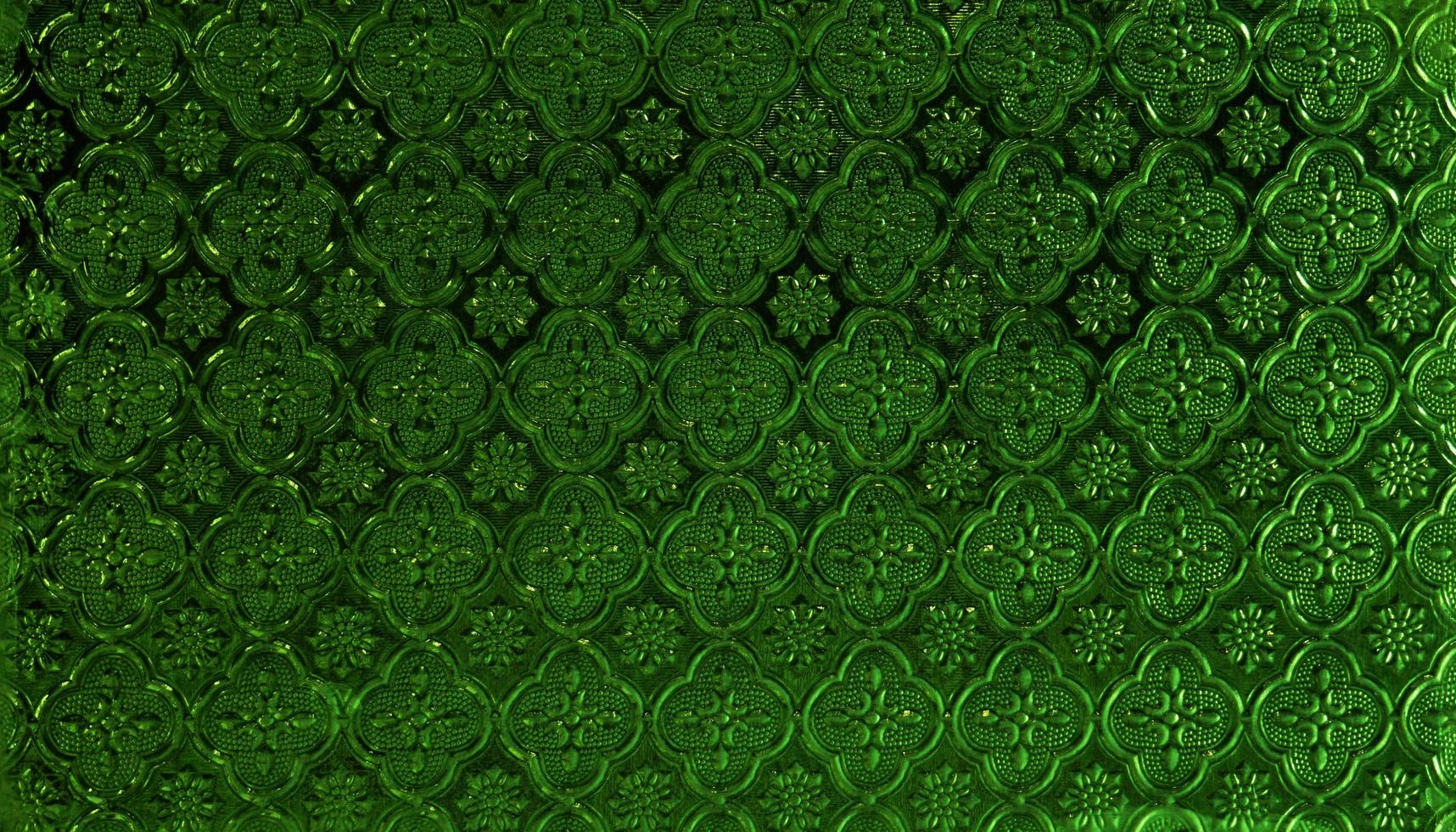 The green colorful glass pattern texture background. photo