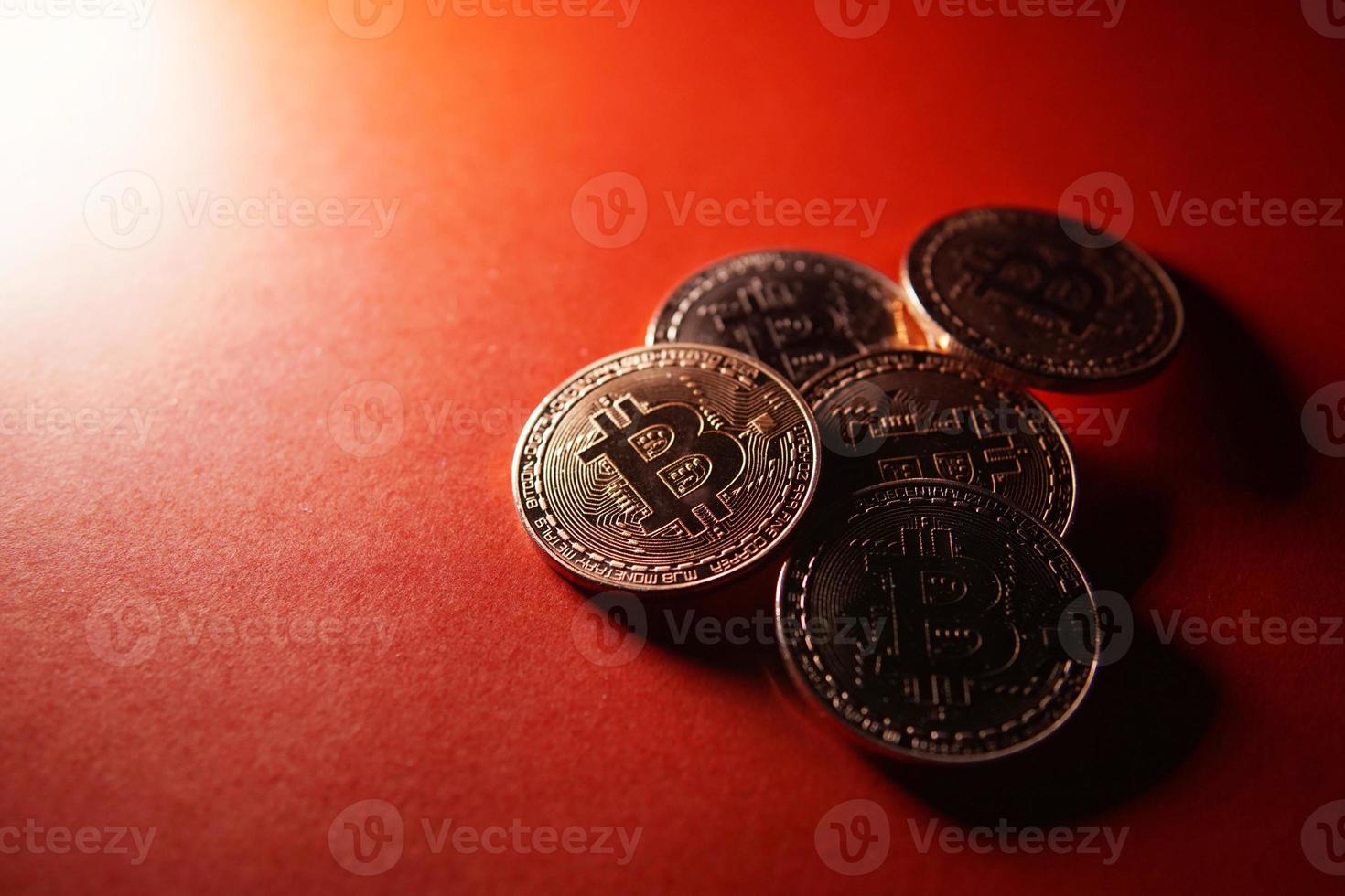 Bitcoin crypto currency isolated on red background. photo