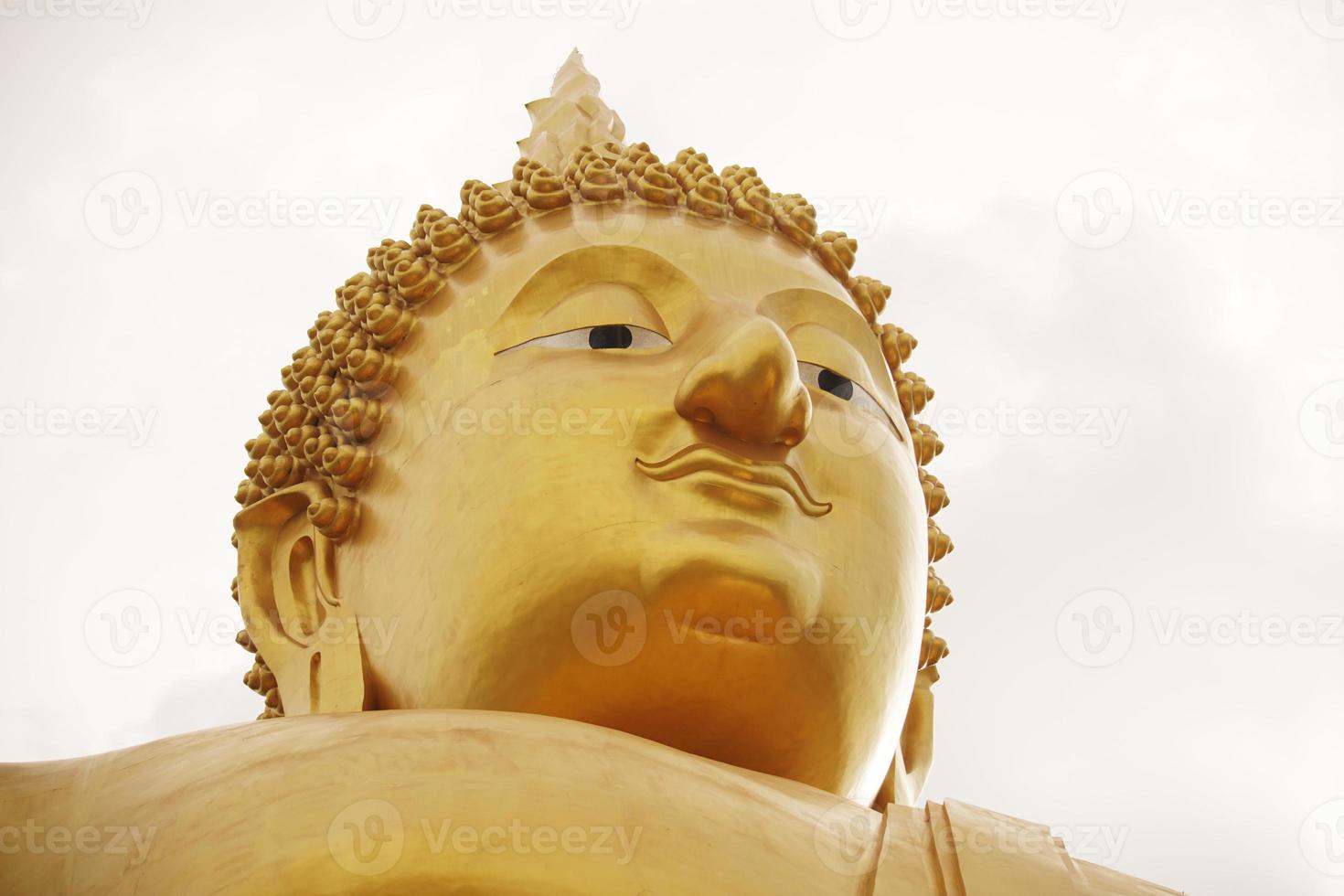 Buddha statue in pubic temple of thailand. Isolated on white background. photo