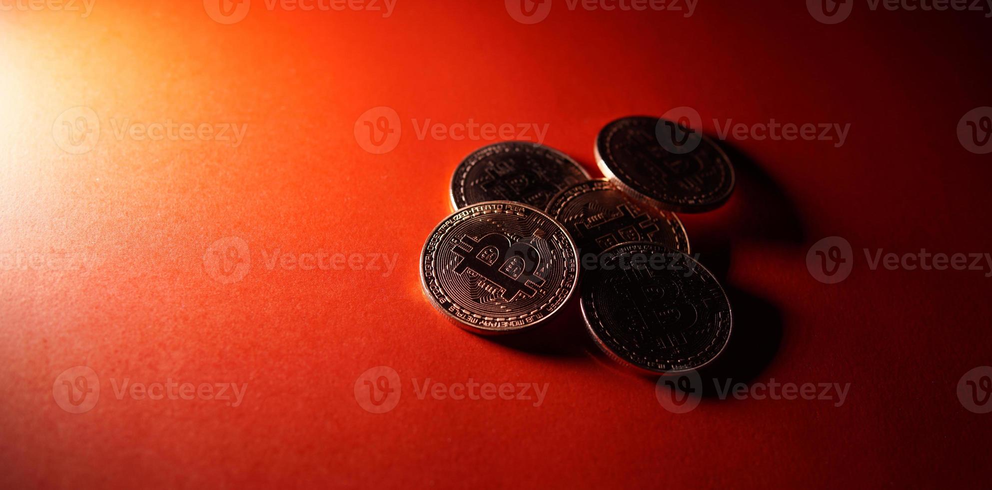 Bitcoin crypto currency isolated on red background. photo