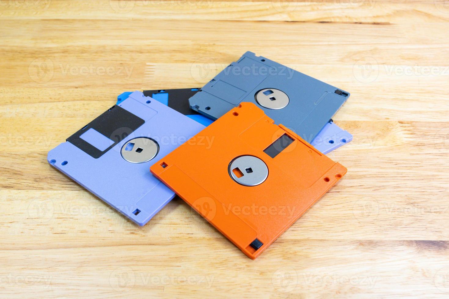 A floppy disk or diskette disk was a ubiquitous form of data storage and exchange from the mid-1970s into the mid-2000, concept old technology photo