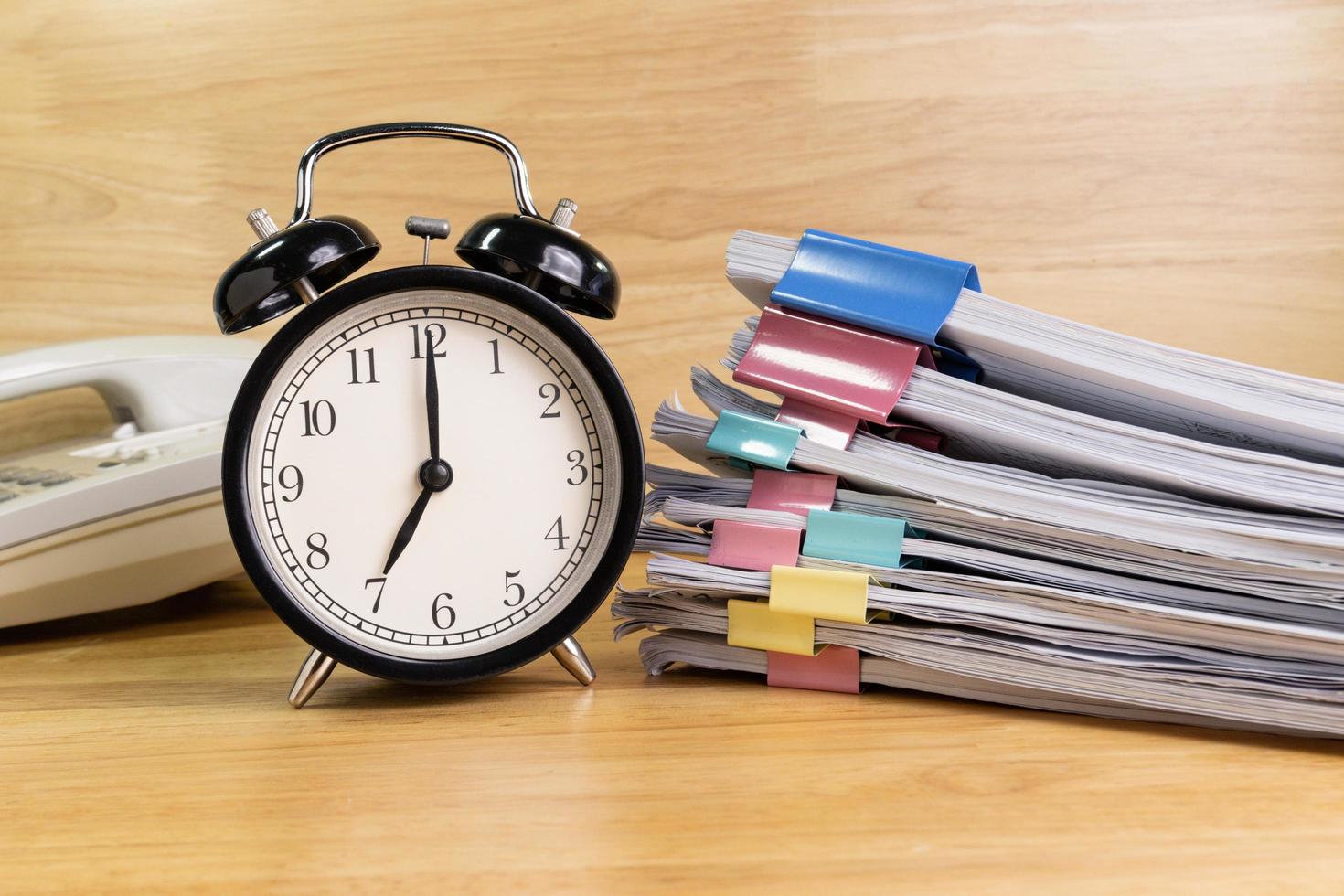 7 AM Clock on work desk in the office Time of business working concepts selective clock photo