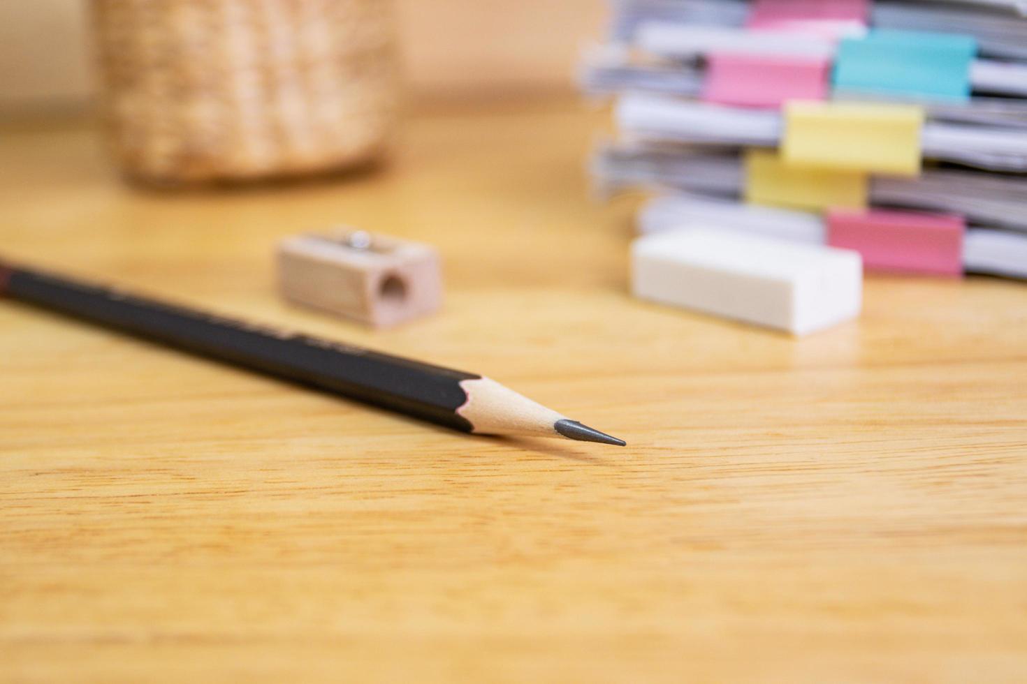 pencil on notebook concept education school equipment on wood table photo