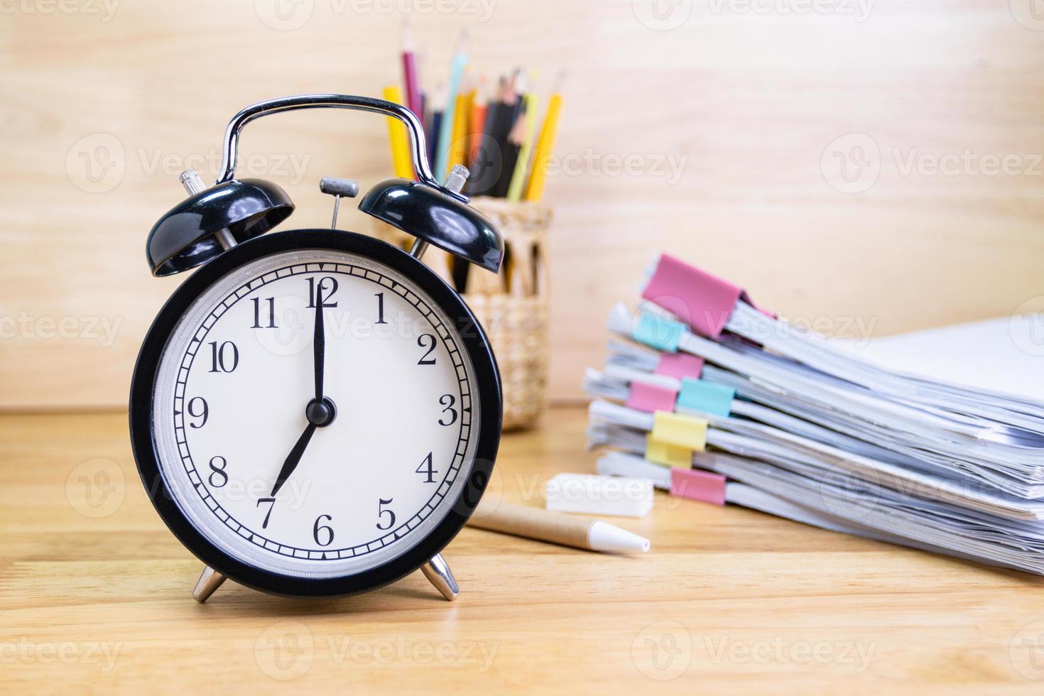 7 AM Clock on work desk in the office Time of business working concepts selective clock photo