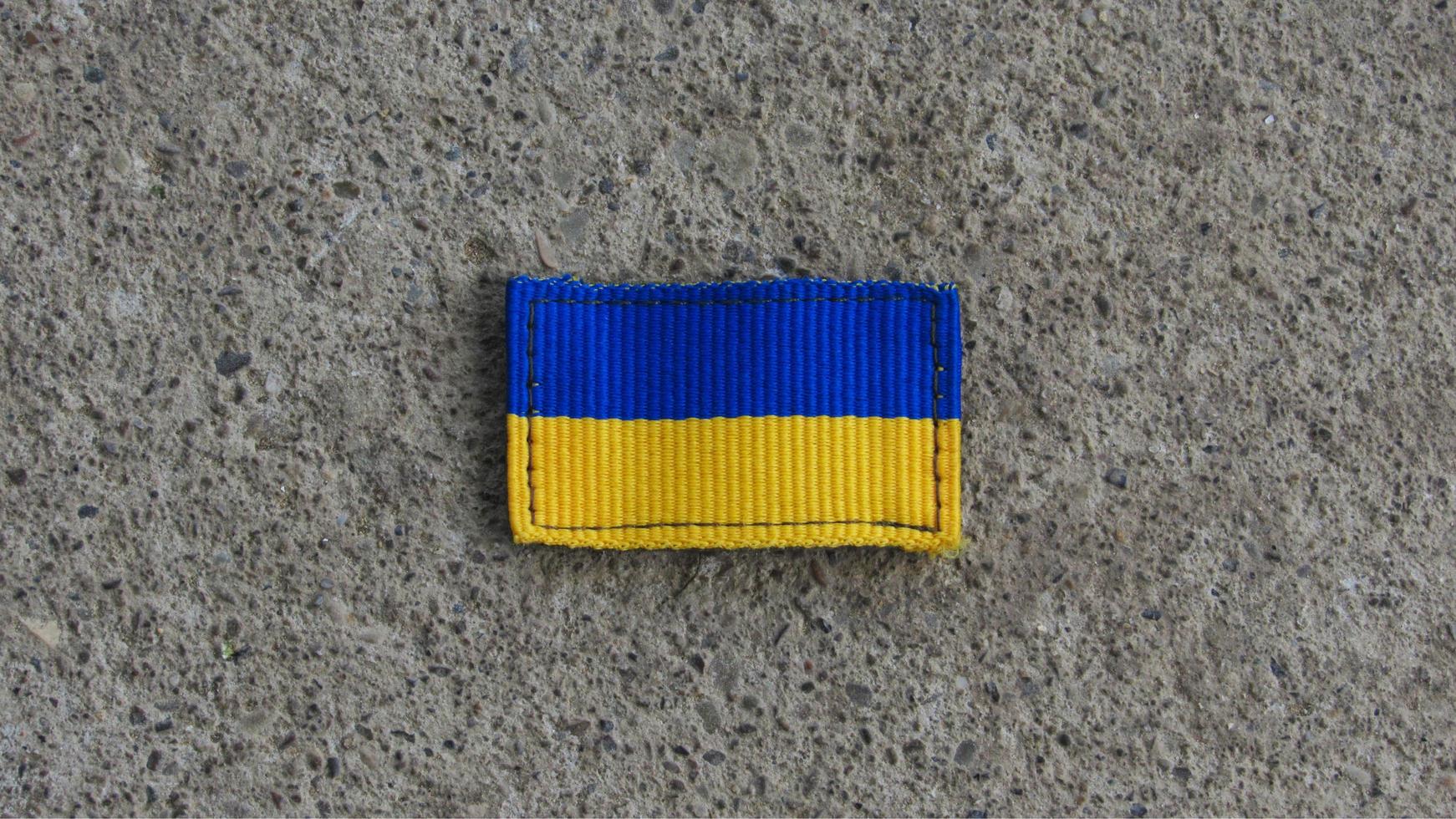 Ukraine flag on the ground photo