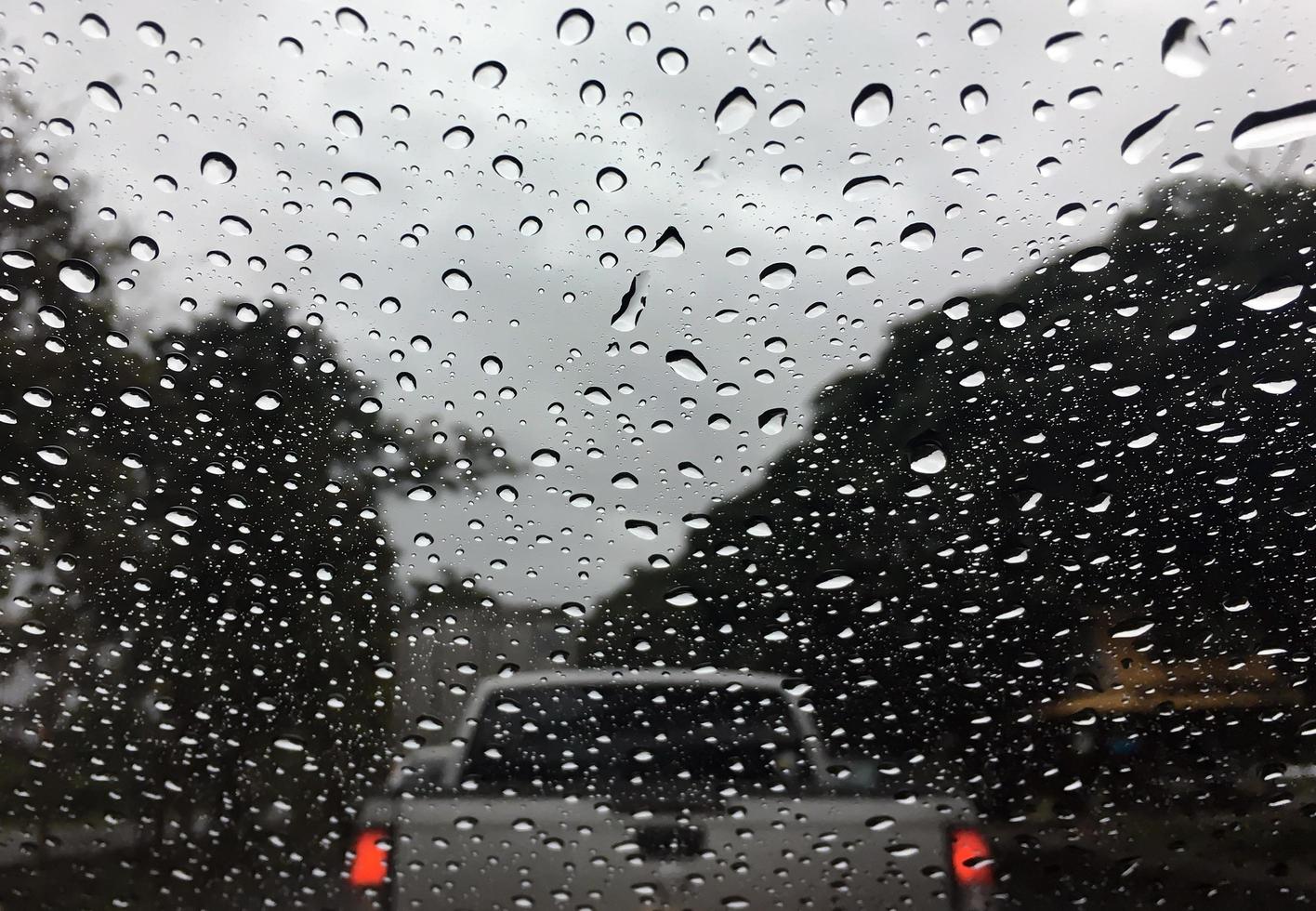 Rain drops of water on a car glass abstract background texture photo