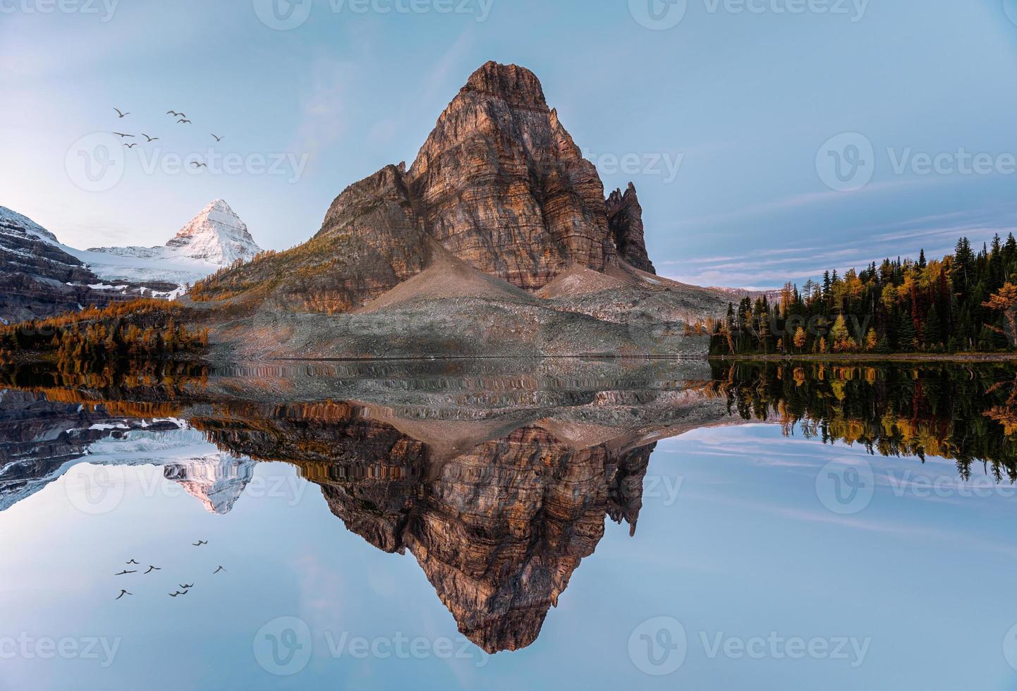 Scenery of Sunburst lake with mount Assiniboine reflections in the morning at Provincial park photo