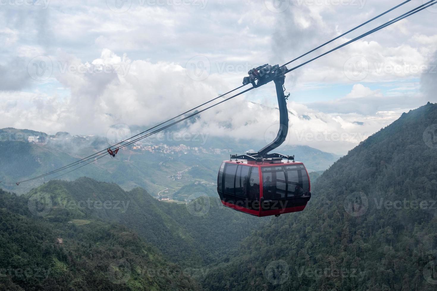 Red cable car sightseeing Sapa village in valley photo