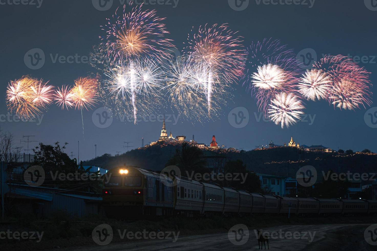 Antique train on railway with colorful fireworks in annual event on Phra Nakhon Khiri, Khao Wang photo