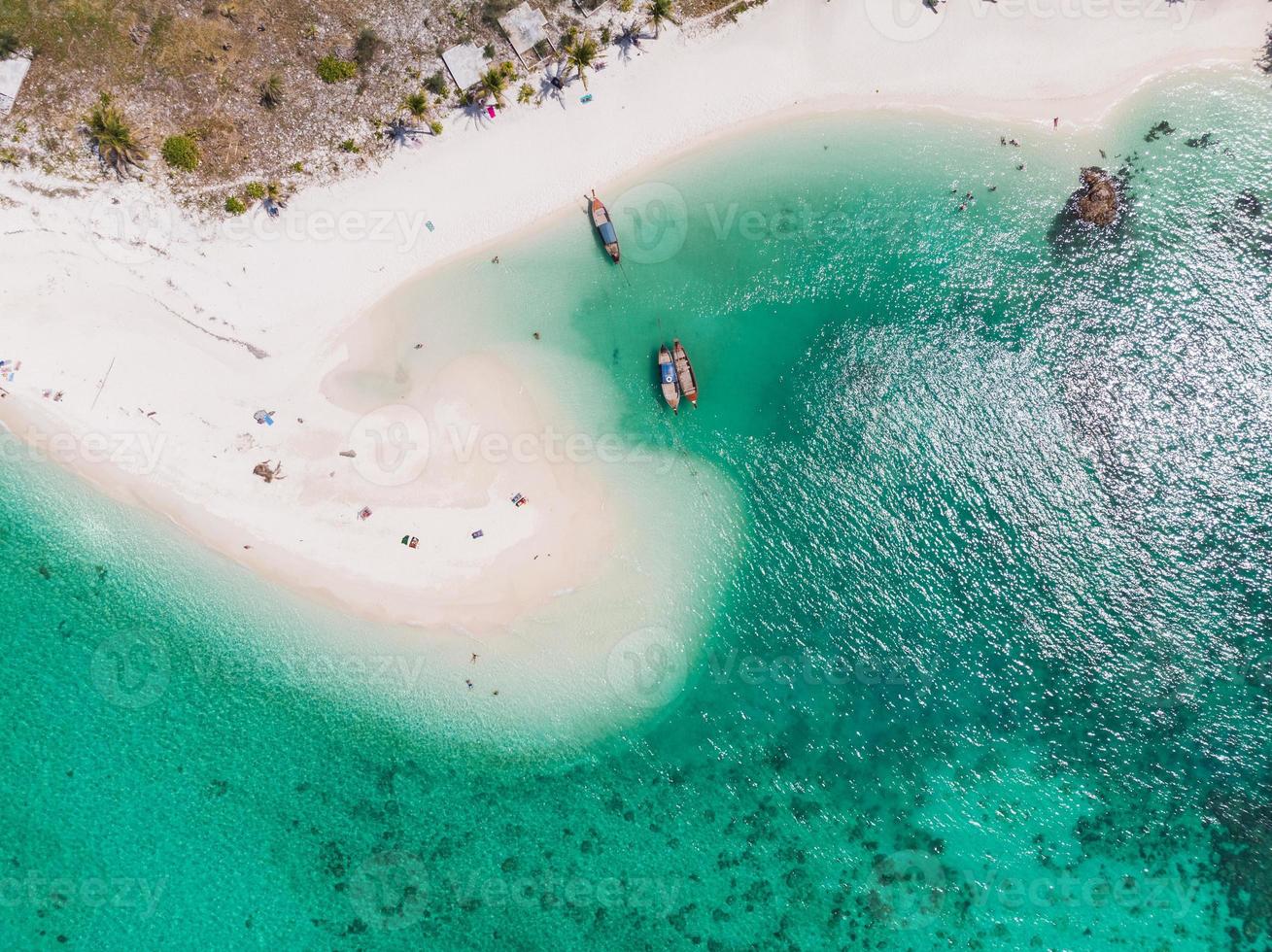 White beach with coral reef in tropical sea at Lipe island photo
