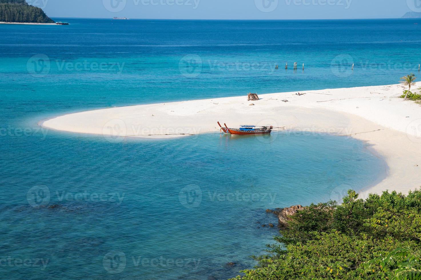 Karma beach with long-tail boat in tropical sea at Lipe island photo