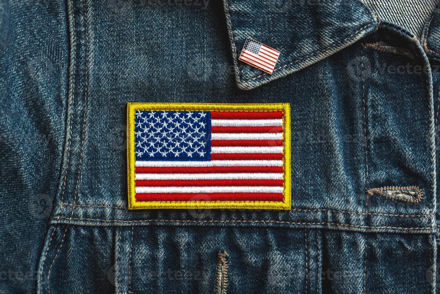 Happy Independence day July 4th. American flag textile patch on a denim jacket and American pin photo