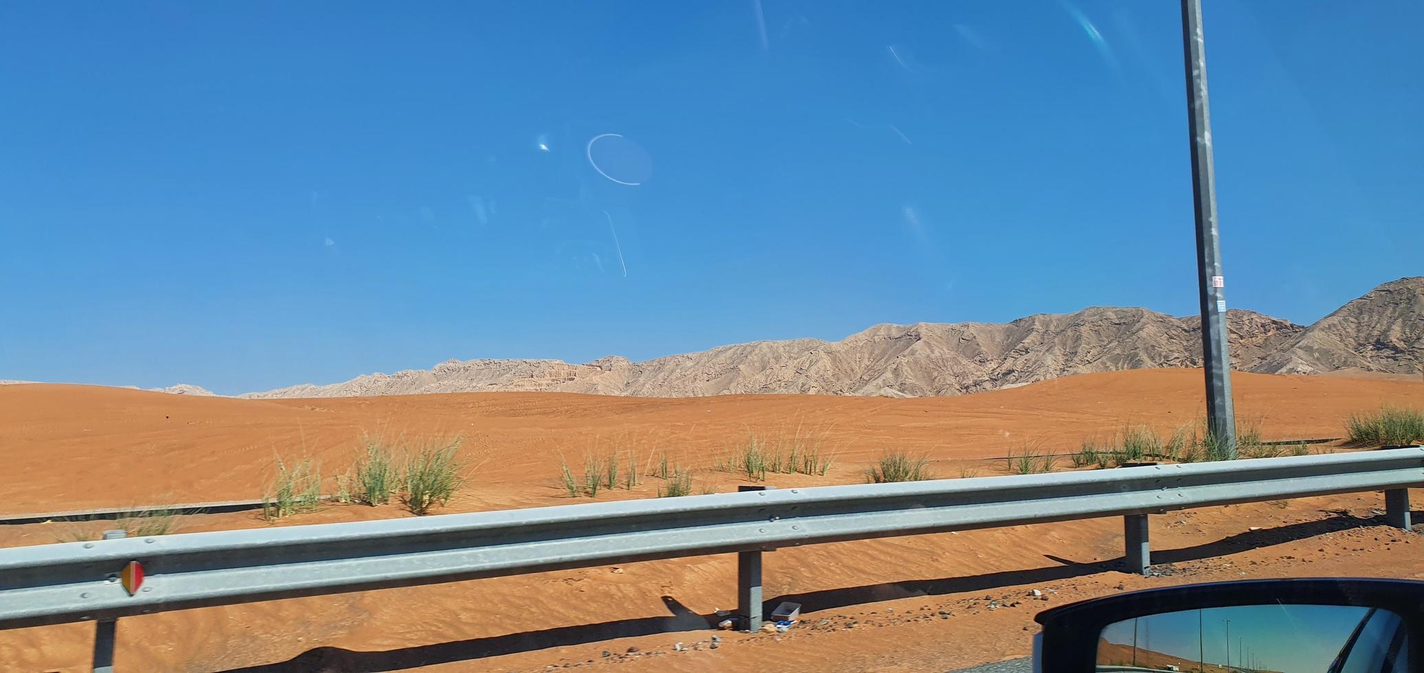 Desert road to the Moreeb Dune in Liwa Oasis area. Emirate of Abu Dhabi, United Arab Emirates photo