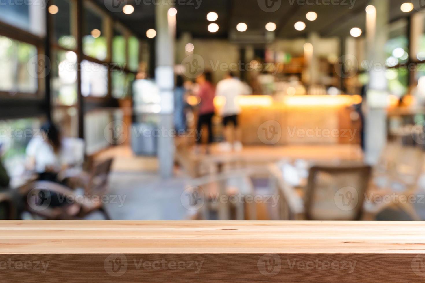 Empty wooden table space platform and blurry defocused restaurant interior, Vintage tone photo