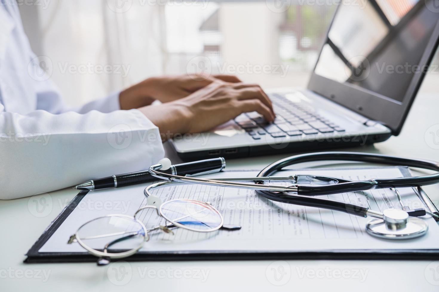 Doctor using a laptop in the hospital, Healthcare and Medicine concept photo