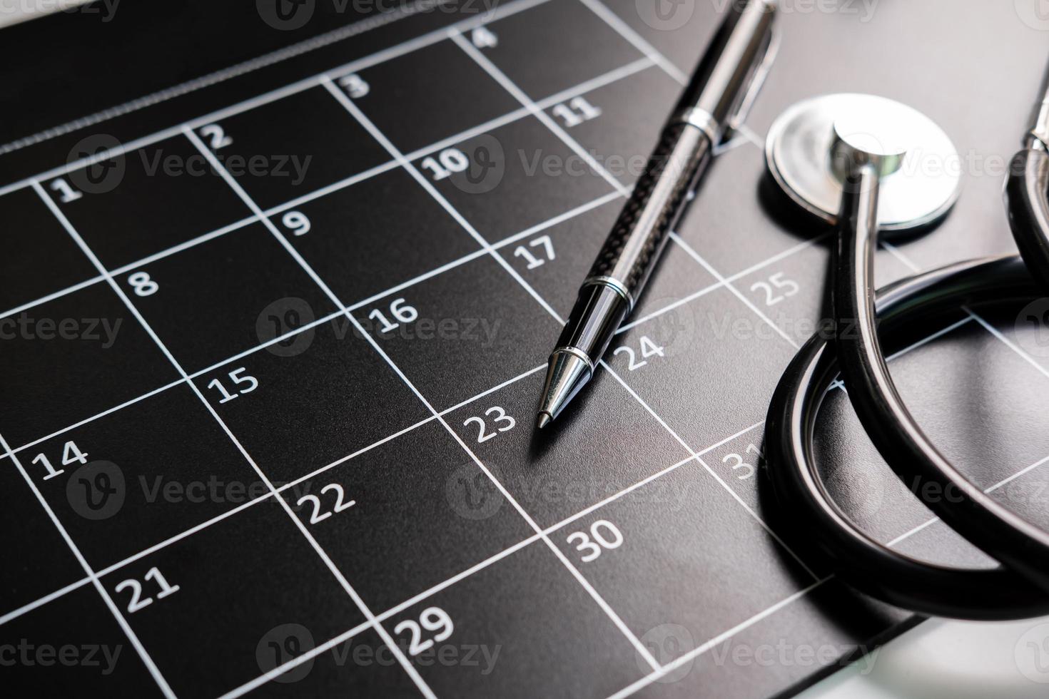Stethoscope with calendar, medical appointment and annual checkup concept photo