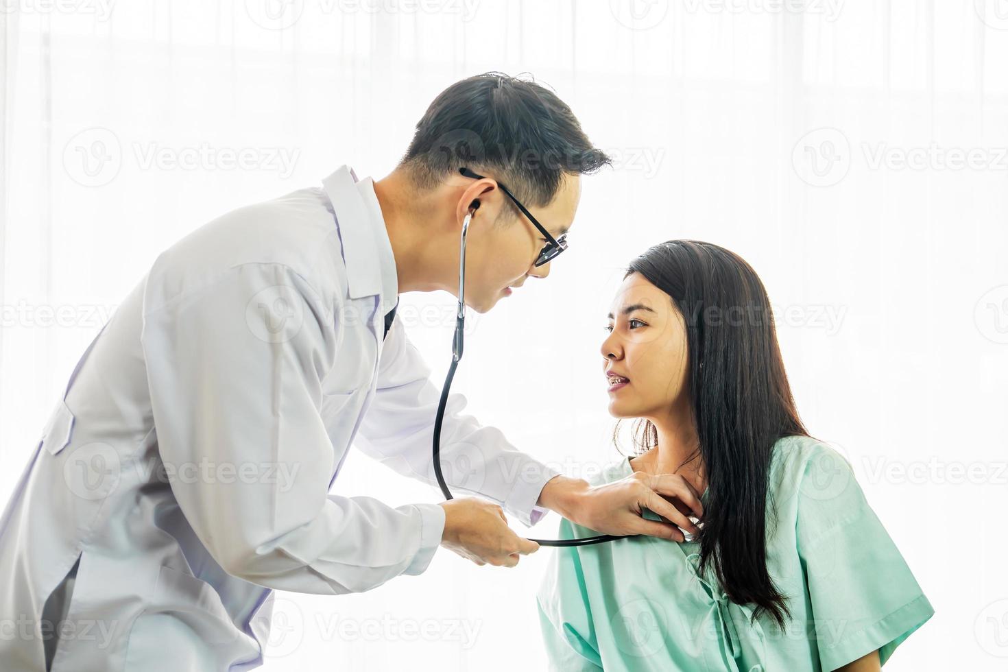 Asian doctor checked the female patient's fever and explain treatment the sick patient on the hospital, Medical healthcare concept. photo