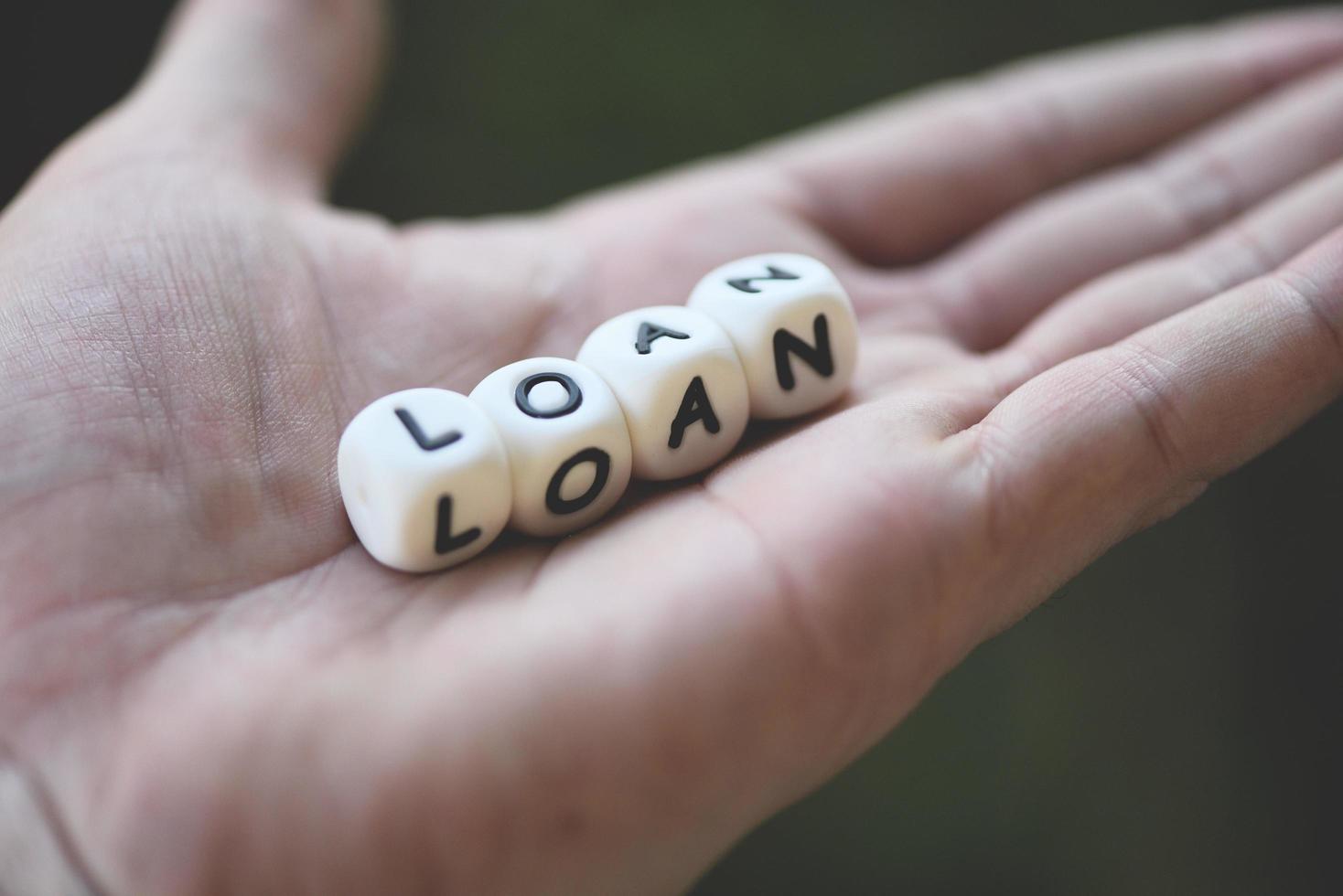 Financial loan or lending for car and home loan agreement and approval concept - word of loan in hand photo