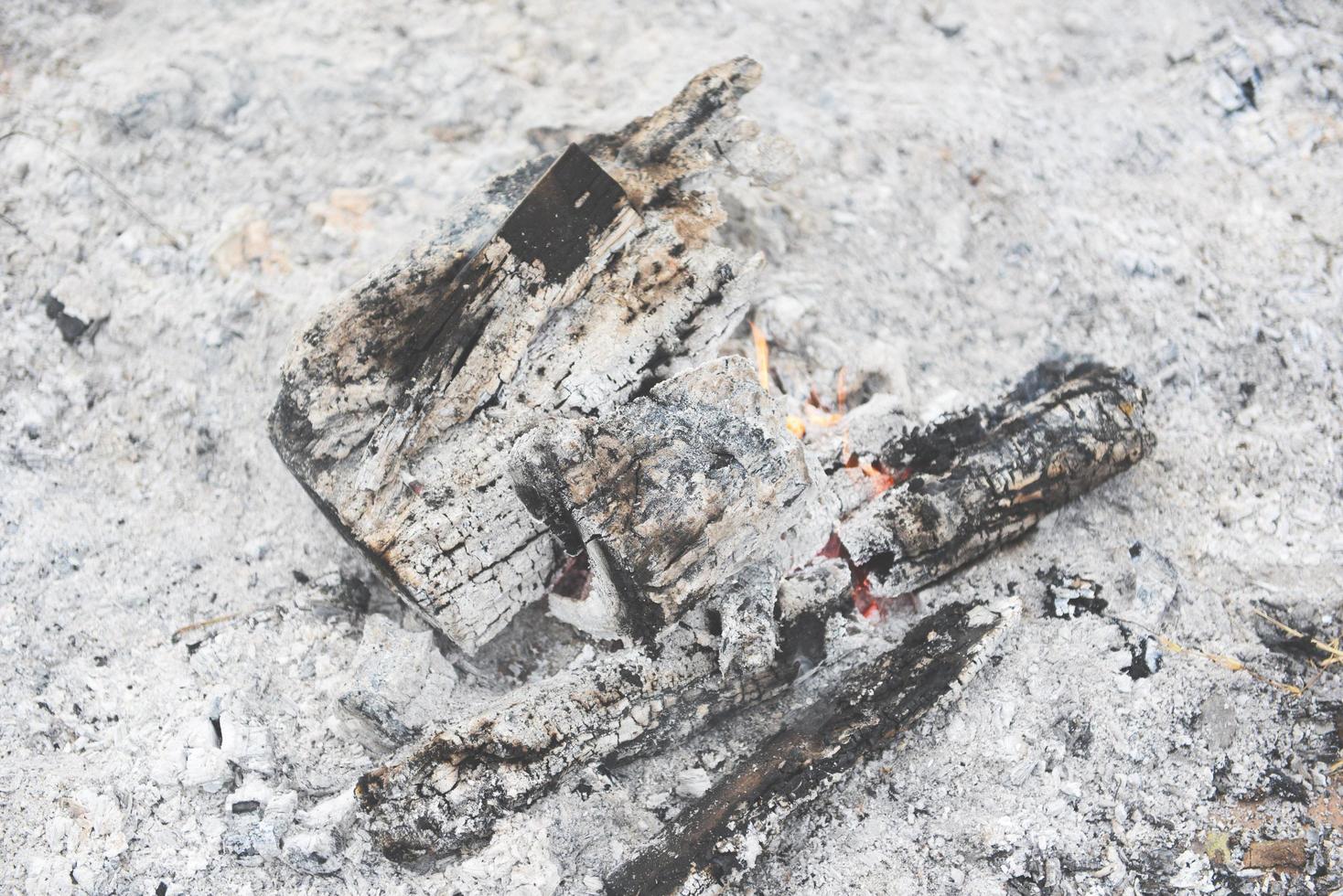 Pile of ashes after the fire bonfire burn wood with ashes and charcoal photo